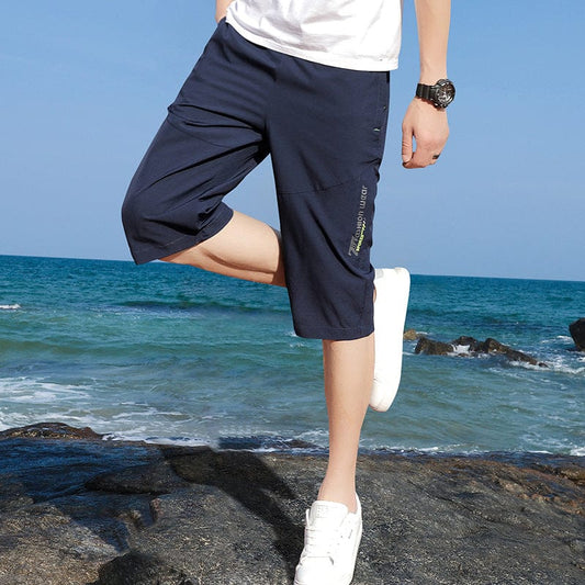 Novedad de verano, pantalones cortos para hombre, versión coreana de la tendencia deportiva, pantalones elásticos de talla grande con siete pantalones, pantalones informales de 7 puntos para hombres jóvenes